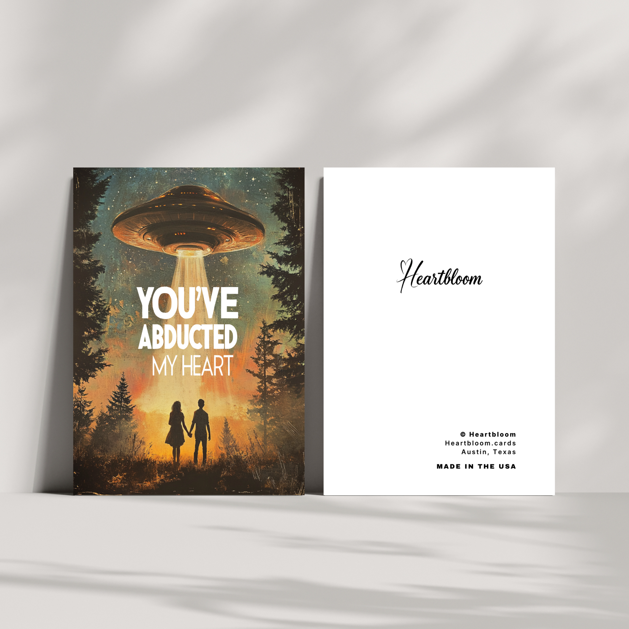 Card with UFO design and 'You've Abducted My Heart' text on a white background