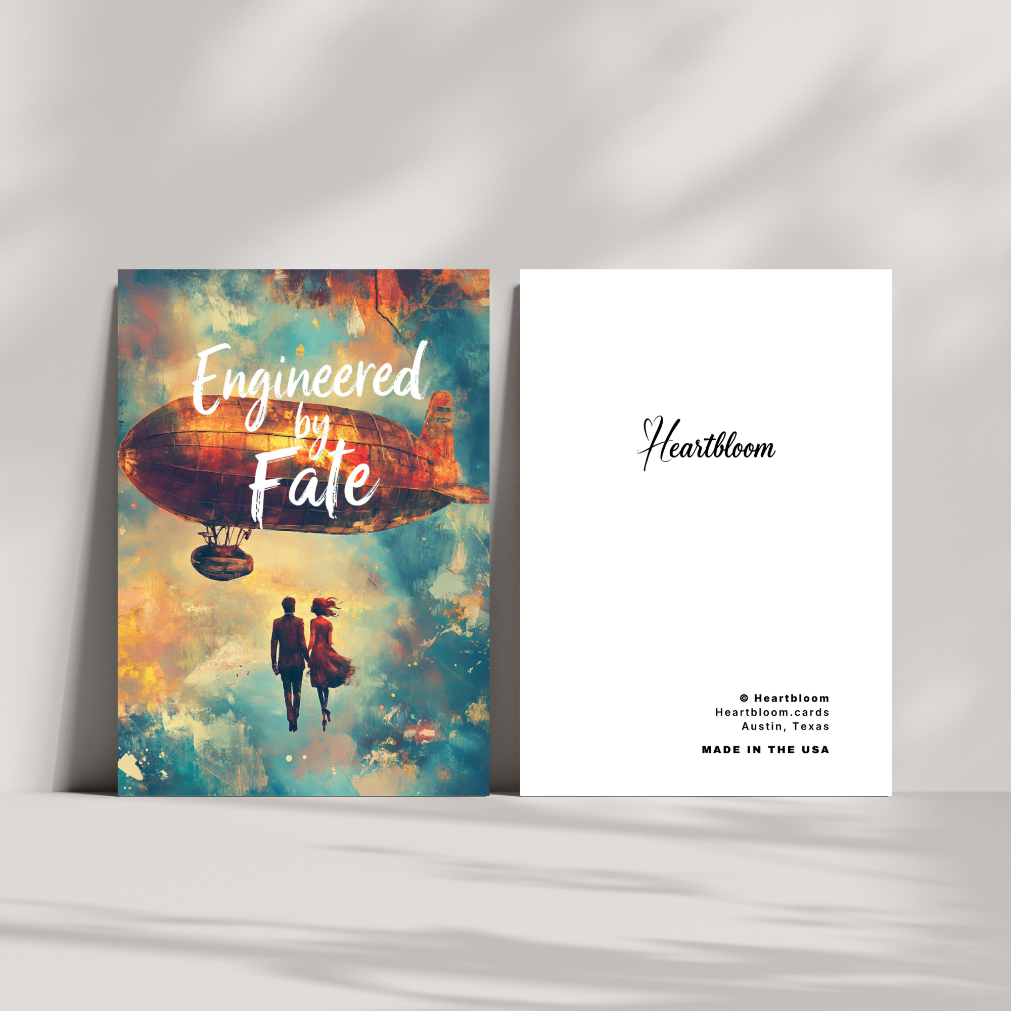 Card with 'Engineered by Fate' design and 'Heartbloom' branding on a white surface.