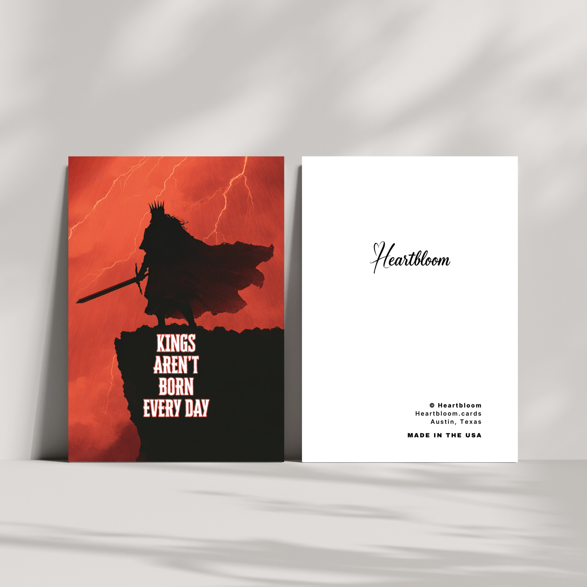 Card with a silhouette of a warrior on an orange background and 'Heartbloom' branding.