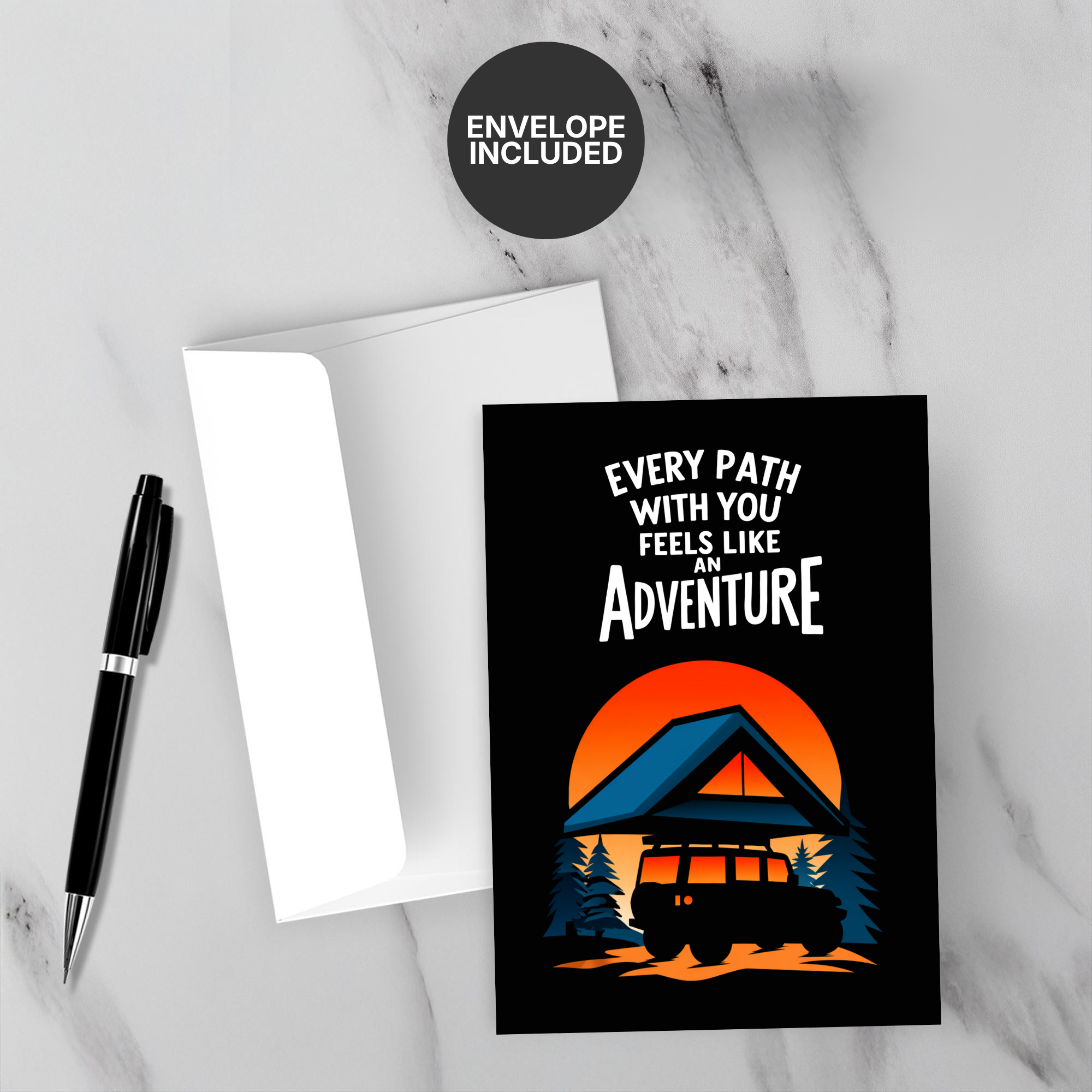 Greeting card with 'Every path with you feels like an adventure' text and a car at sunset, on a marble surface with a pen and envelope.