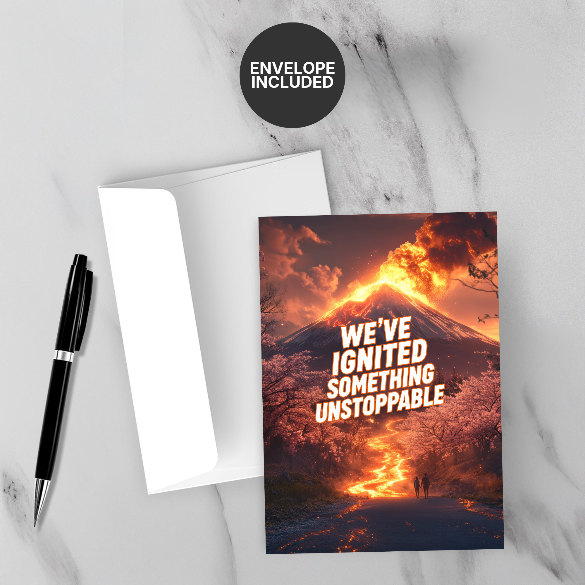 Greeting card with font 'WE'VE IGNITED SOMETHING UNSTOPPABLE accompanied by a pen and envelope on marble surface