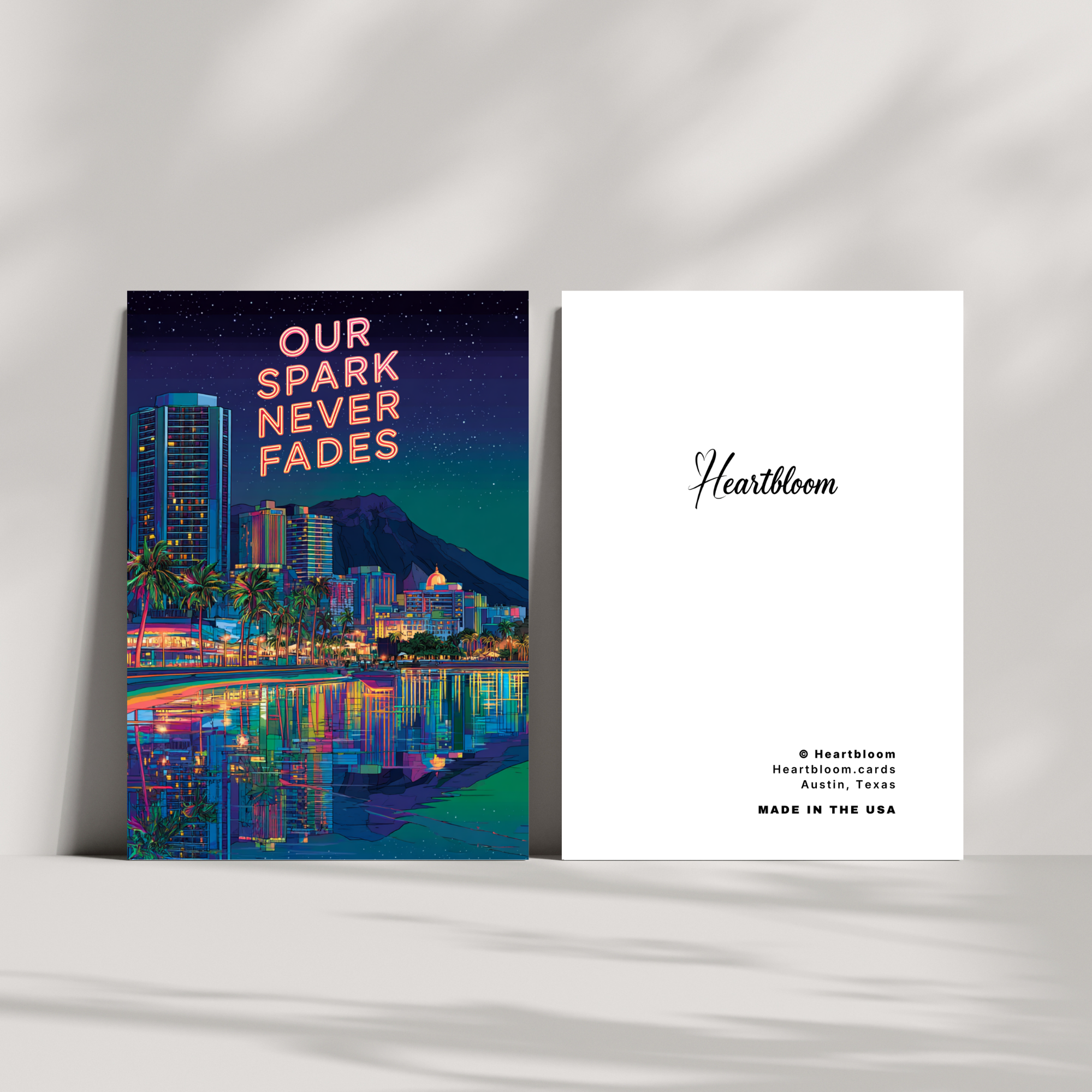 Greeting card with cityscape design and 'Heartbloom' branding on a white surface.