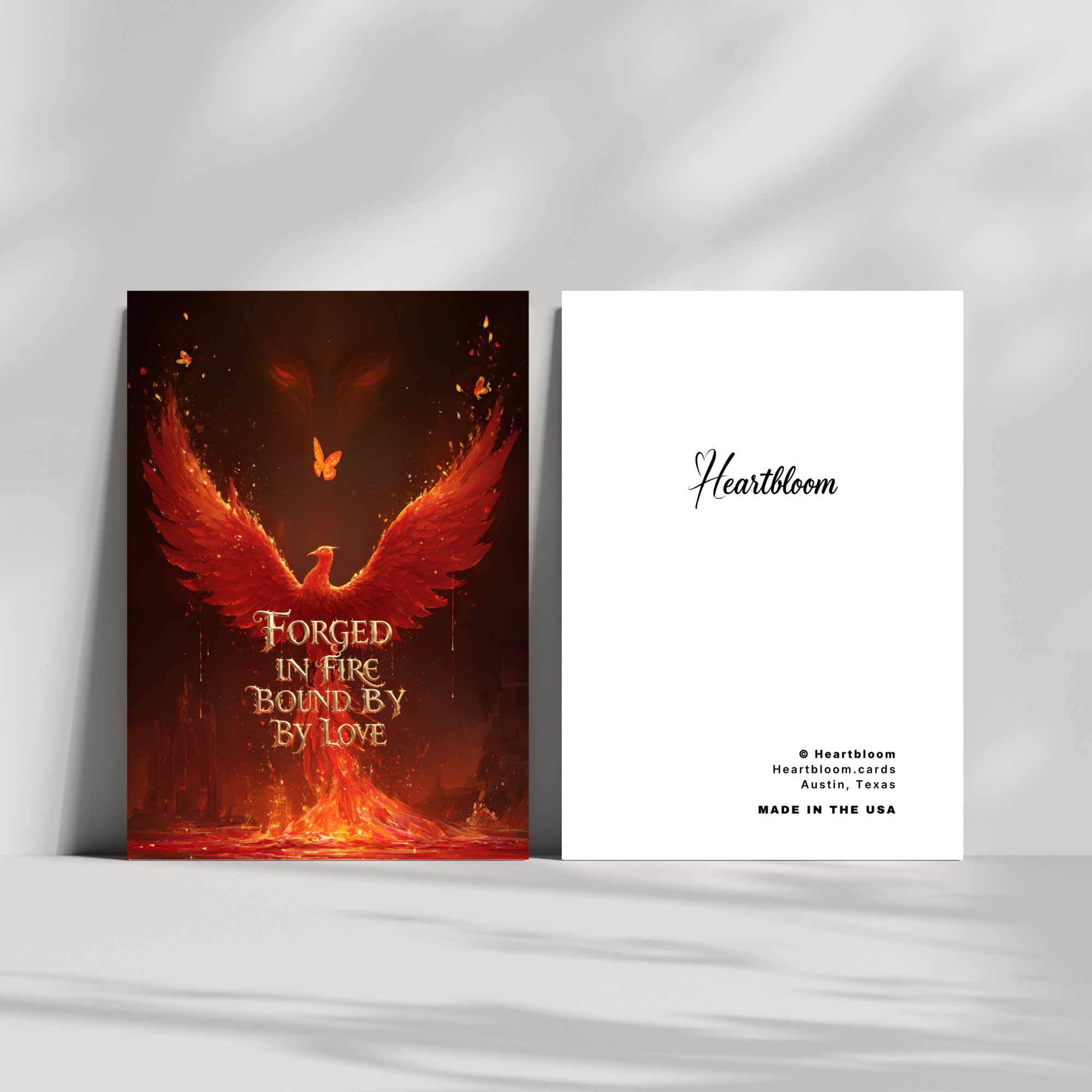 Two greeting cards with a phoenix design and 'Heartbloom' branding on a white background.