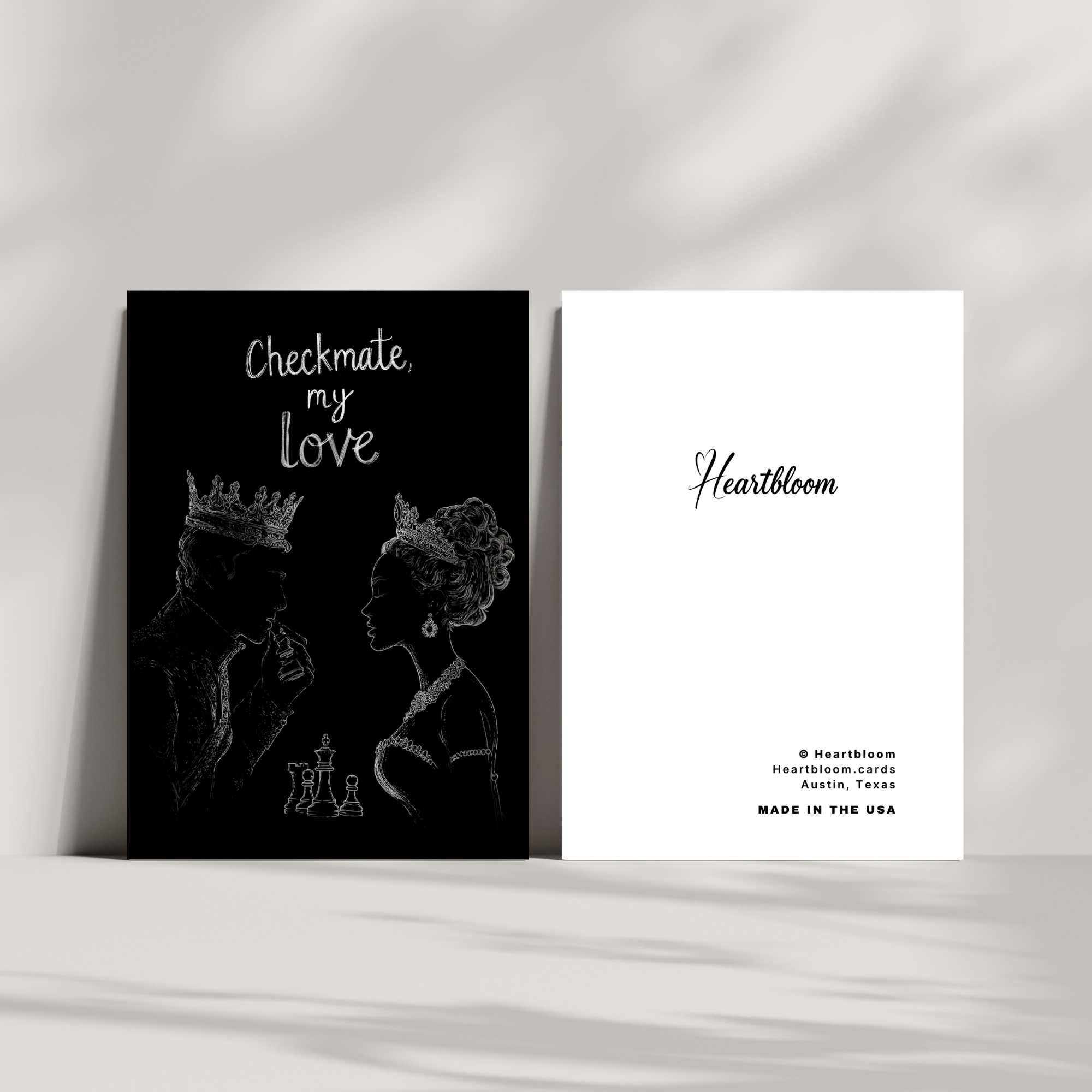 Two greeting cards with black and white designs on a light gray background