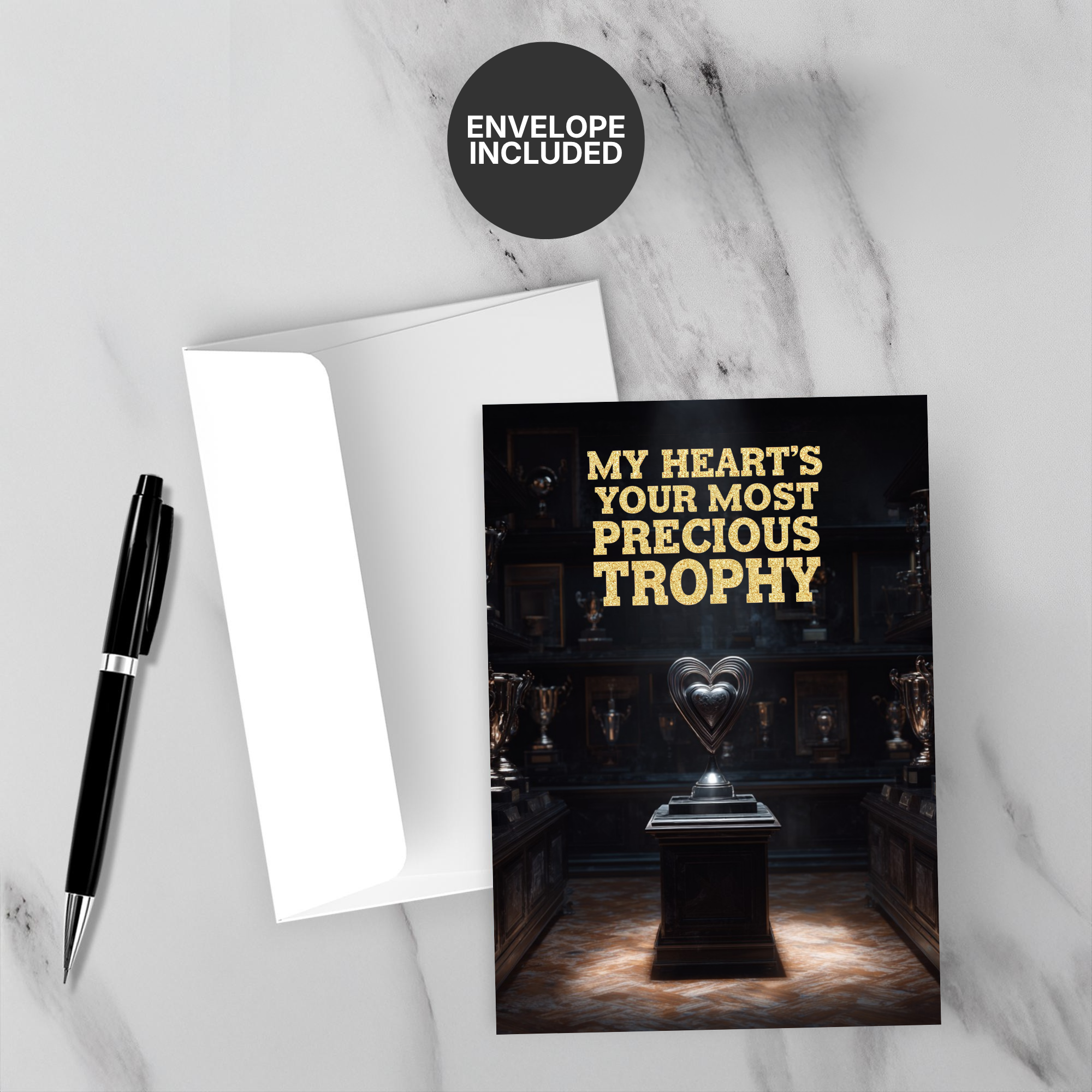 Greeting card with heart trophy design and envelope on marble surface