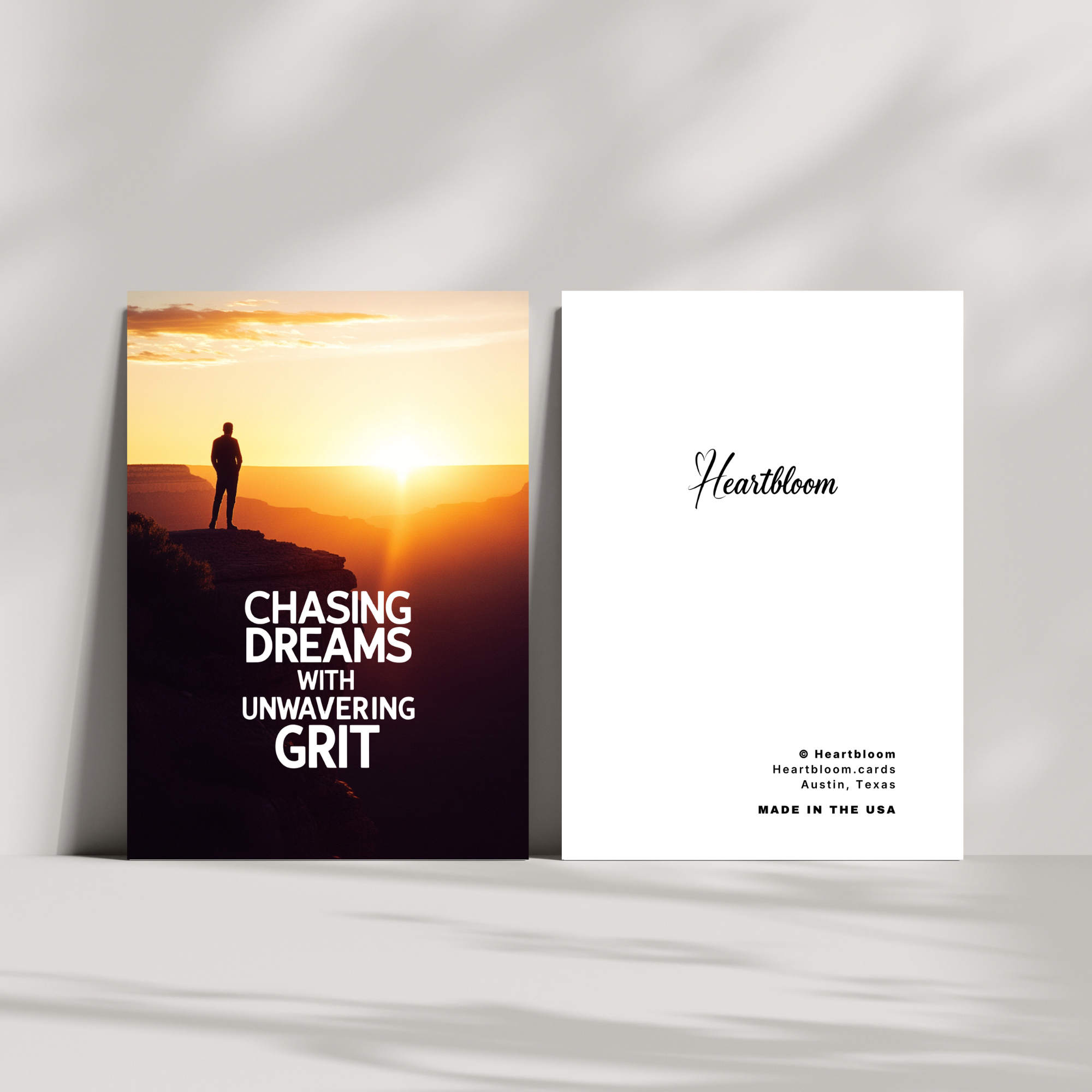 Card with sunset design and motivational text on a white surface