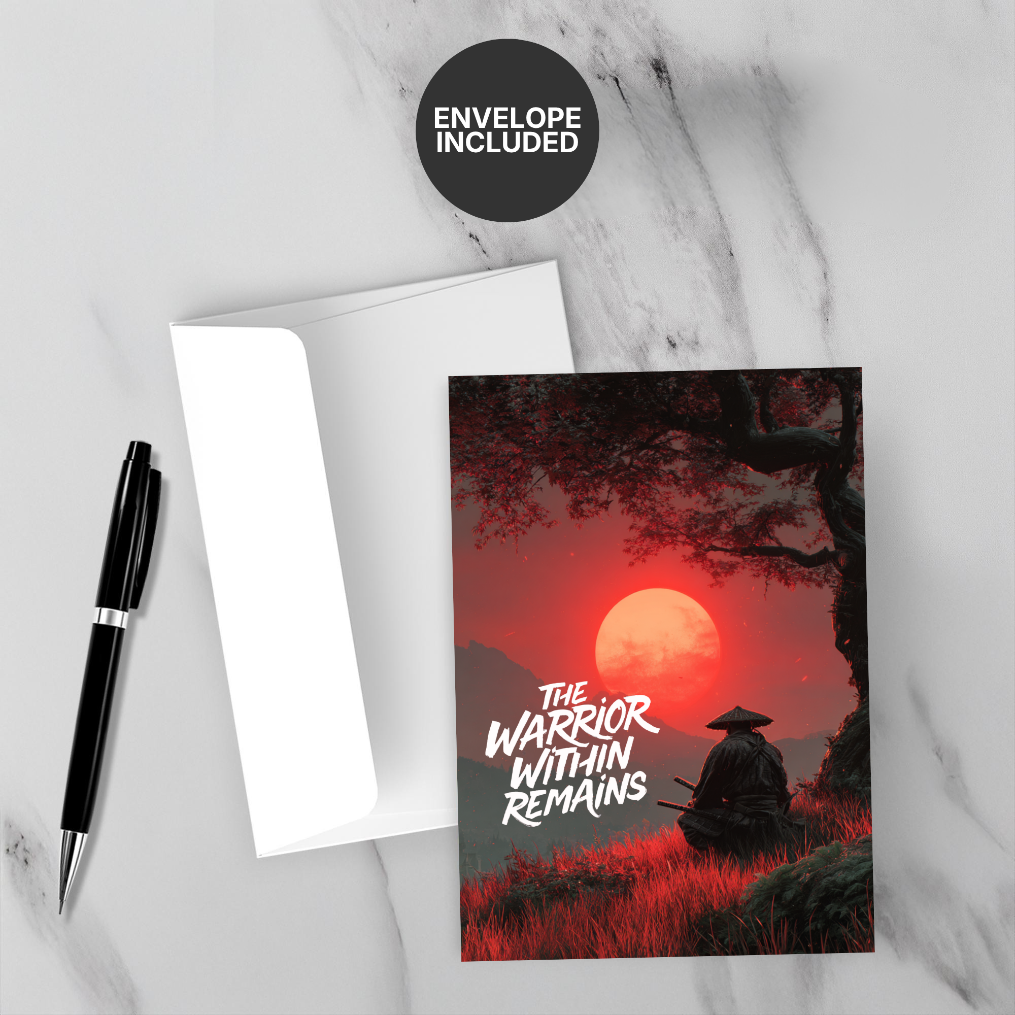 Greeting card with 'The Warrior Within Remains' design on a marble surface with a pen and envelope.