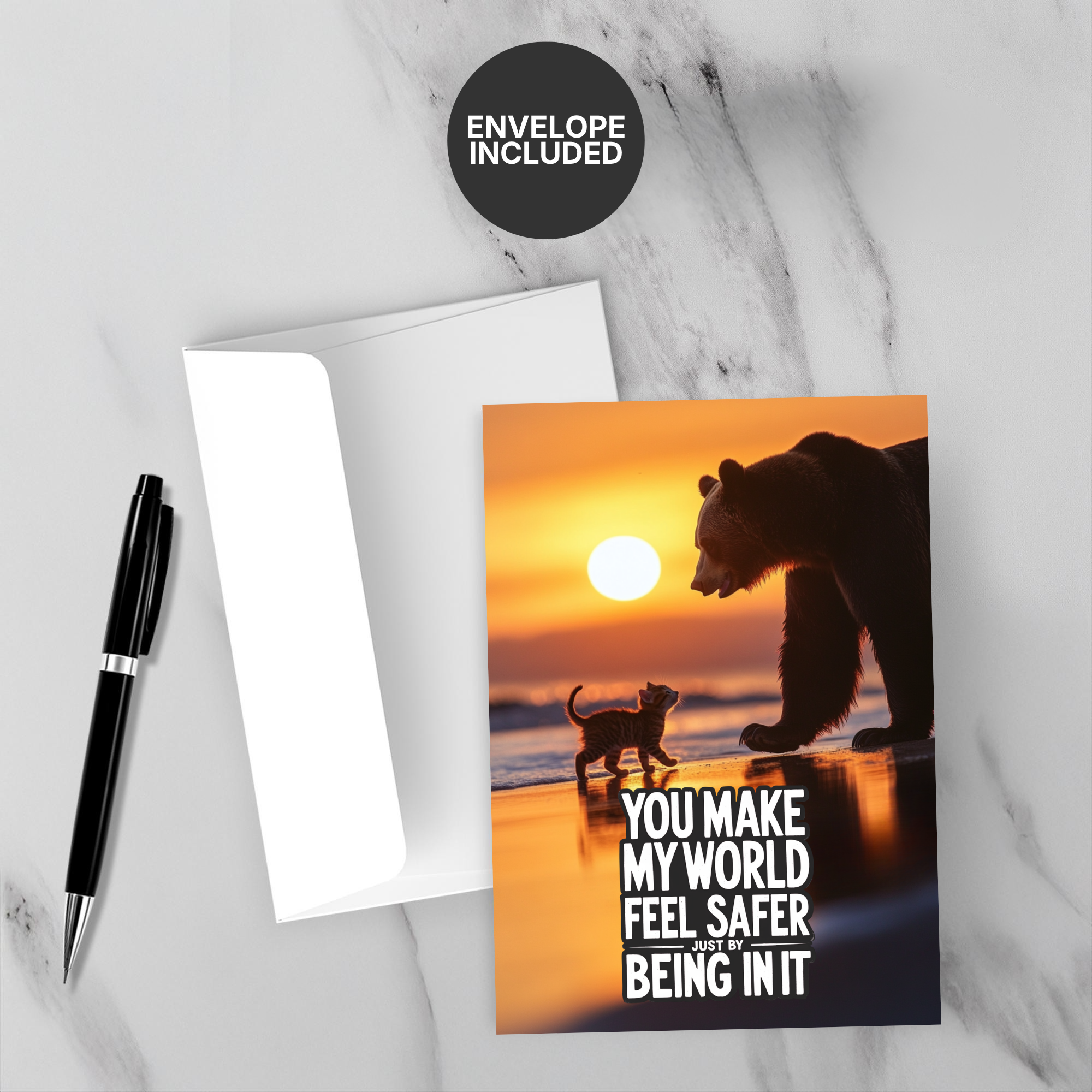 Greeting card with bear and cat silhouette on a sunset beach, envelope included.