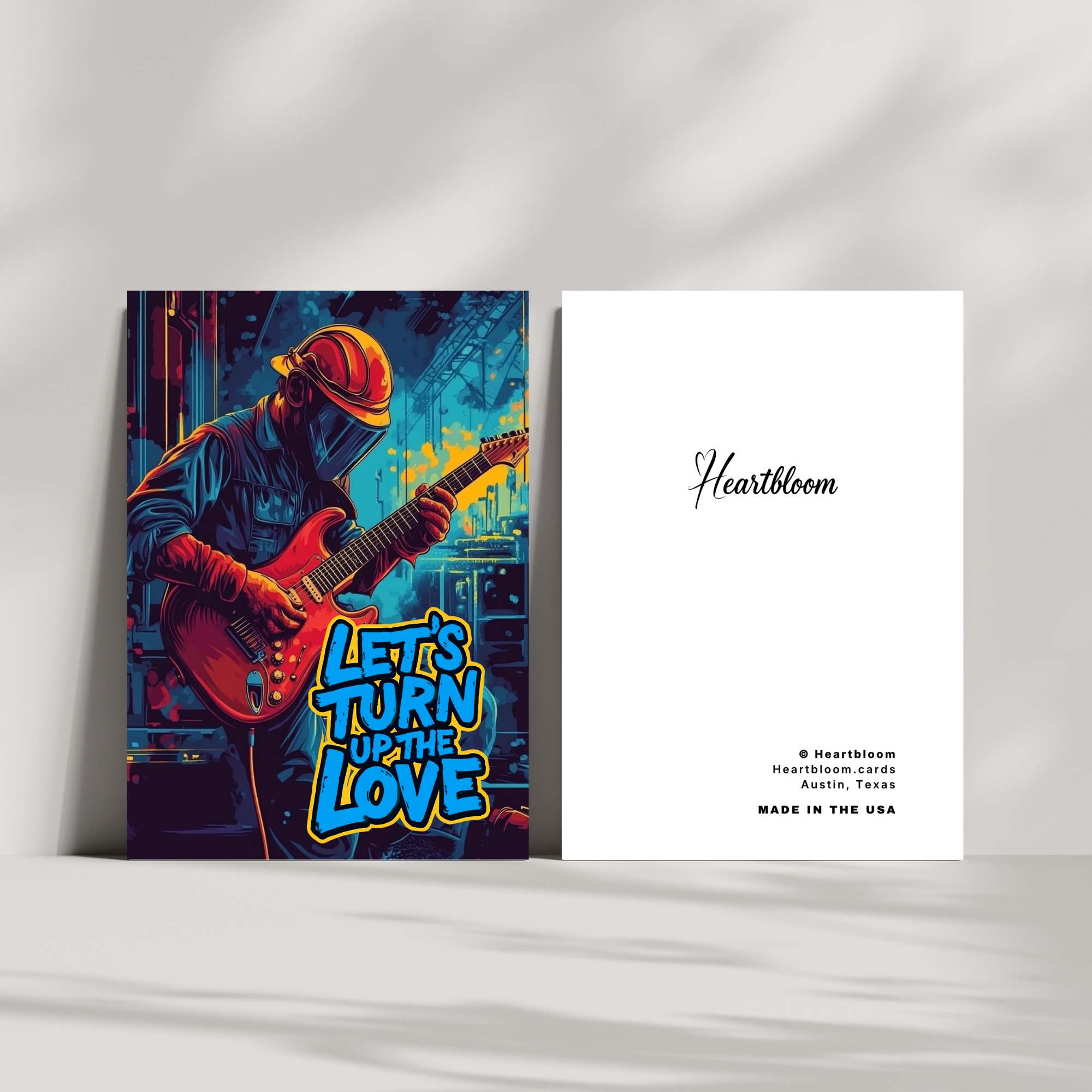 Greeting card with a musician playing guitar and 'Heartbloom' branding on a white background.
