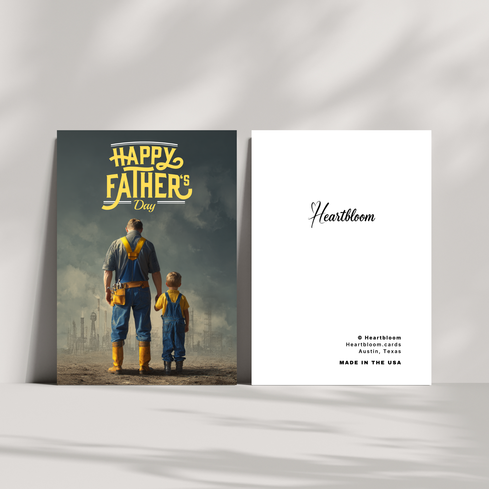 Father's Day card with a man and child in overalls, featuring 'Happy Father's Day' text and Heartbloom branding.