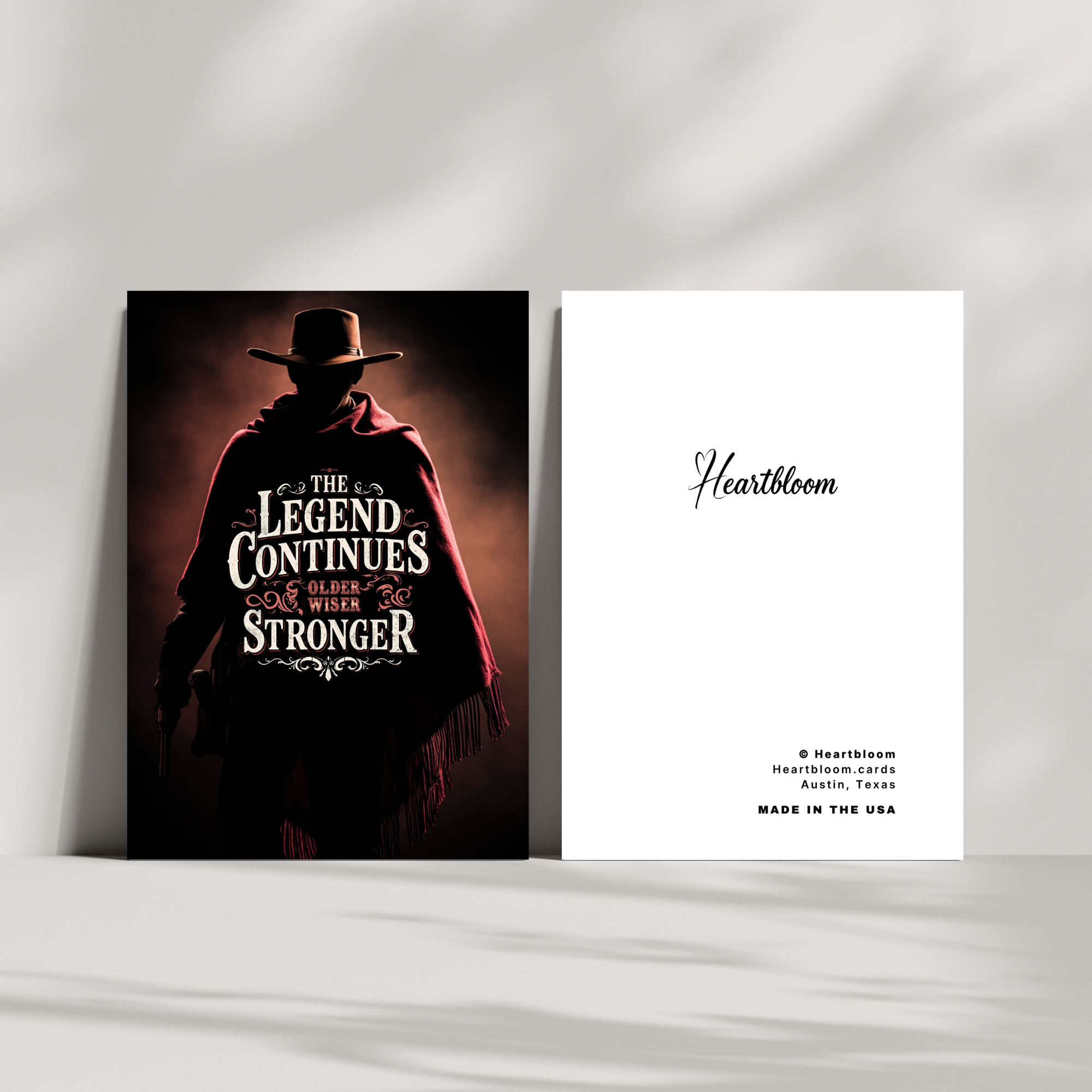 Card with a silhouette of a person in a red cape and hat, with text 'The Legend Continues Older & Stronger', on a white background.