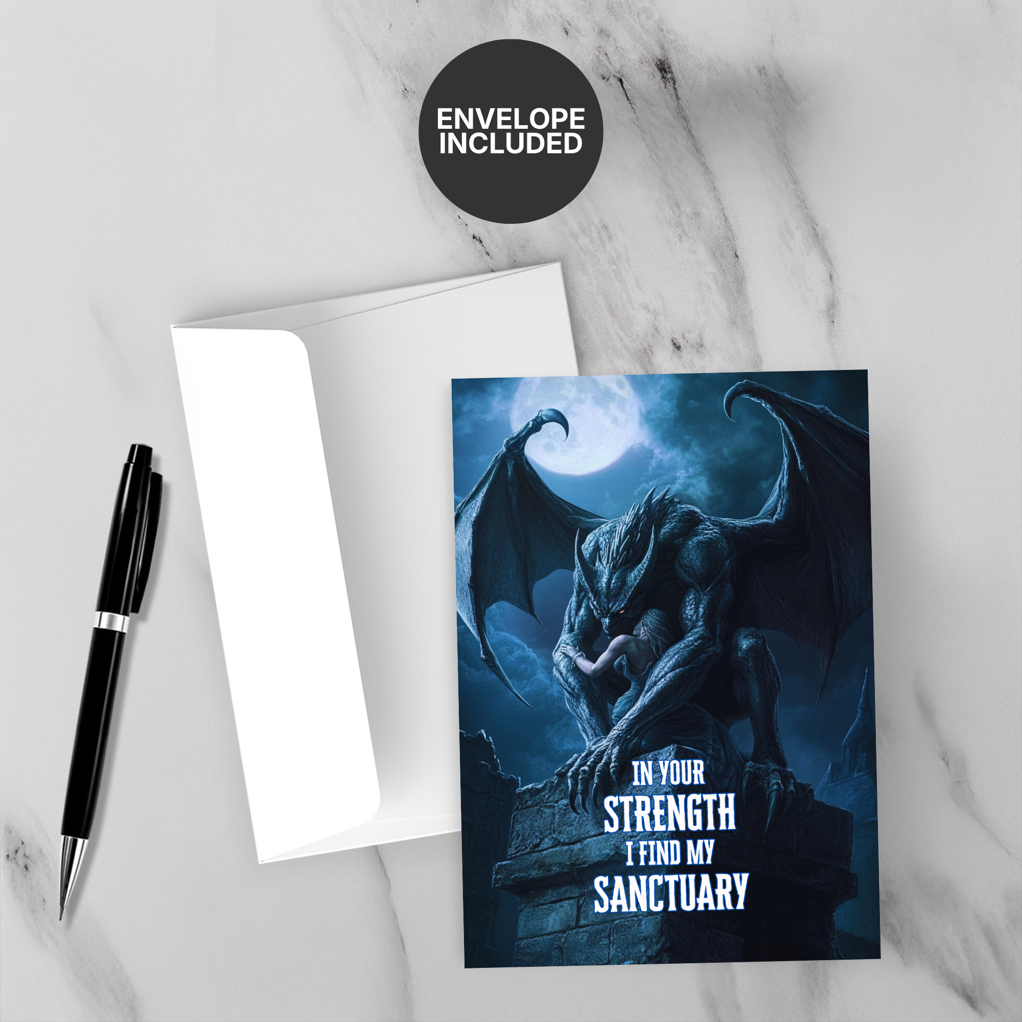 Greeting card with gargoyle design and motivational quote on a marble surface with a pen and envelope.