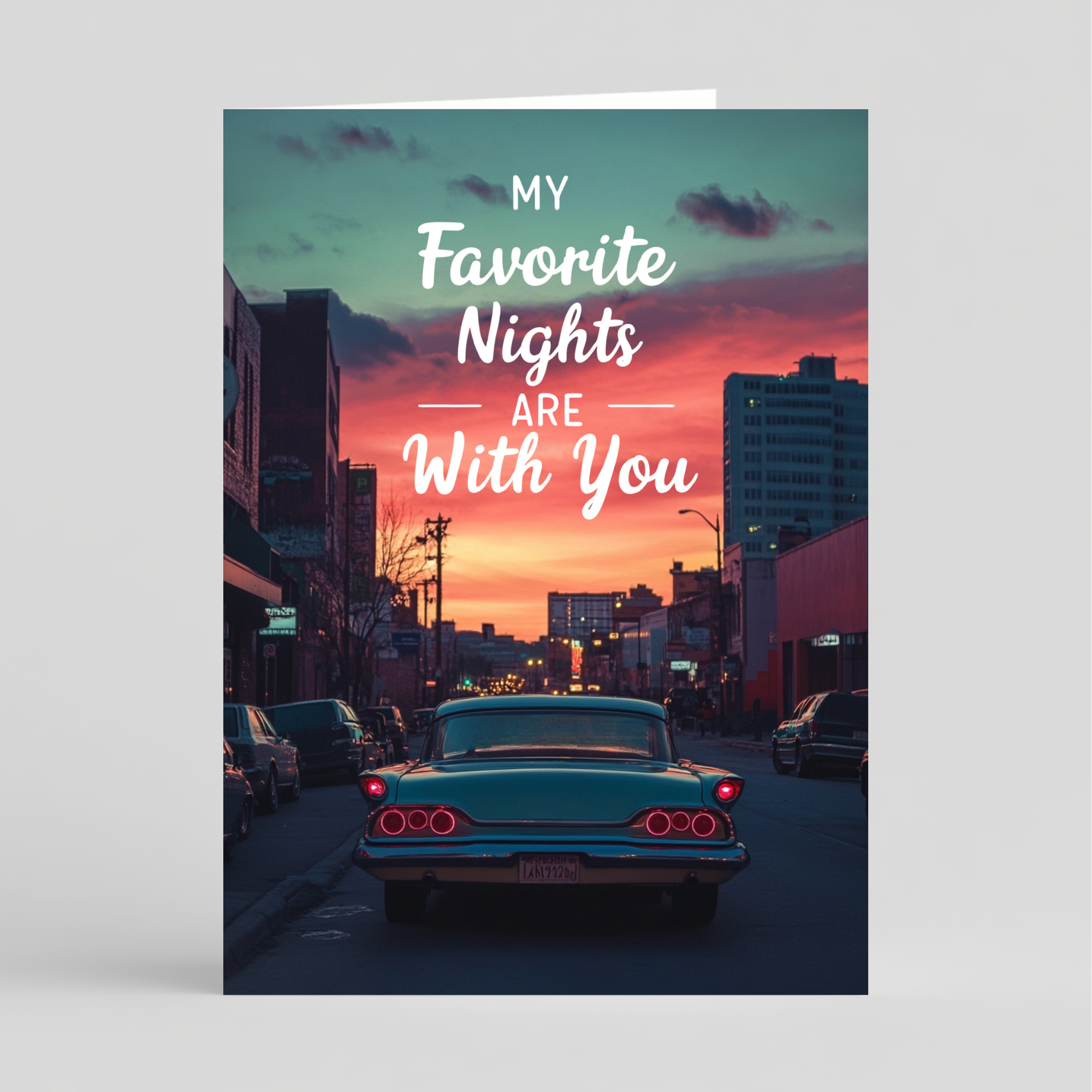 Card with intage car on a city street with a colorful sunset and romantic text overlay.