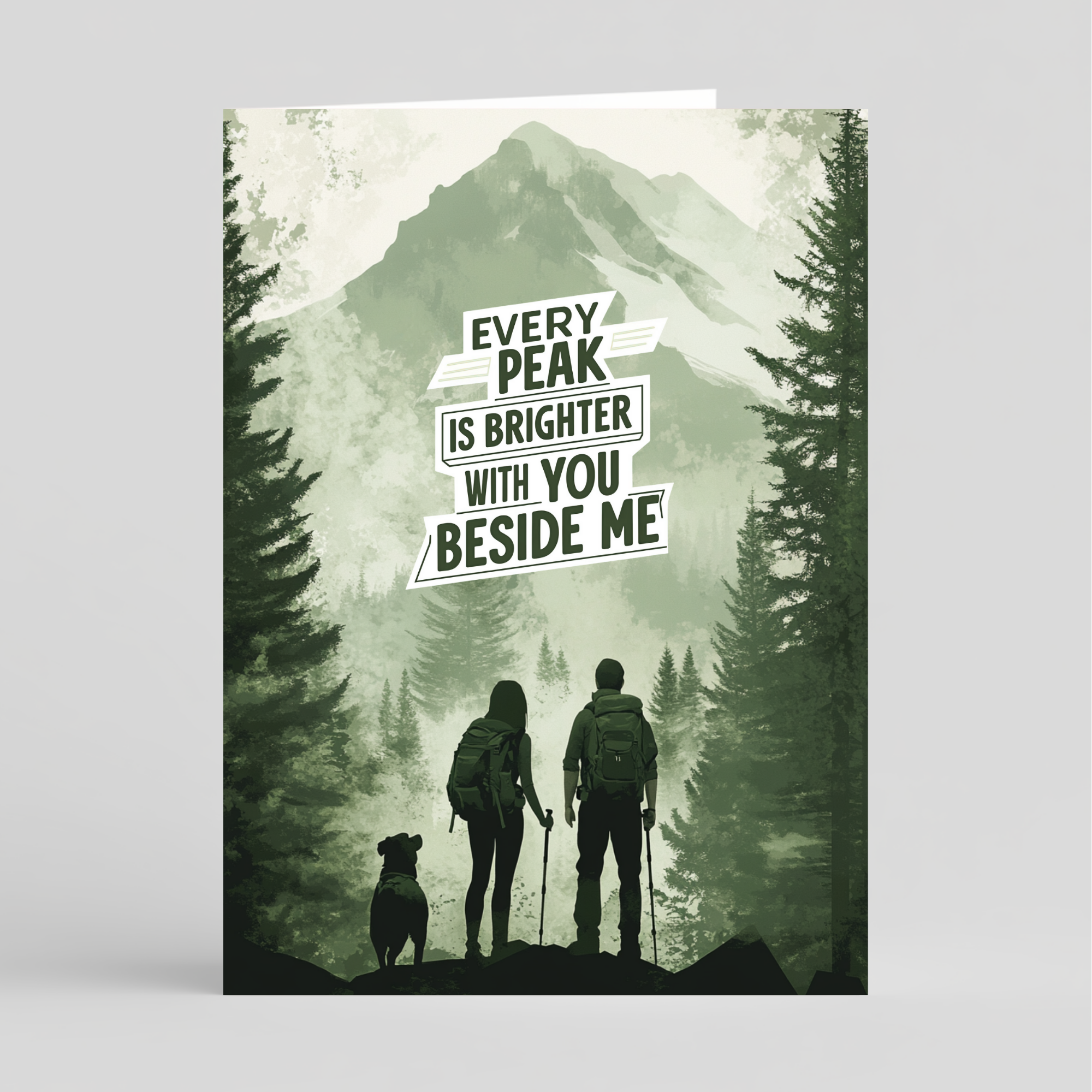 Card of a silhouette of a couple with a dog against a mountainous background with motivational quote.