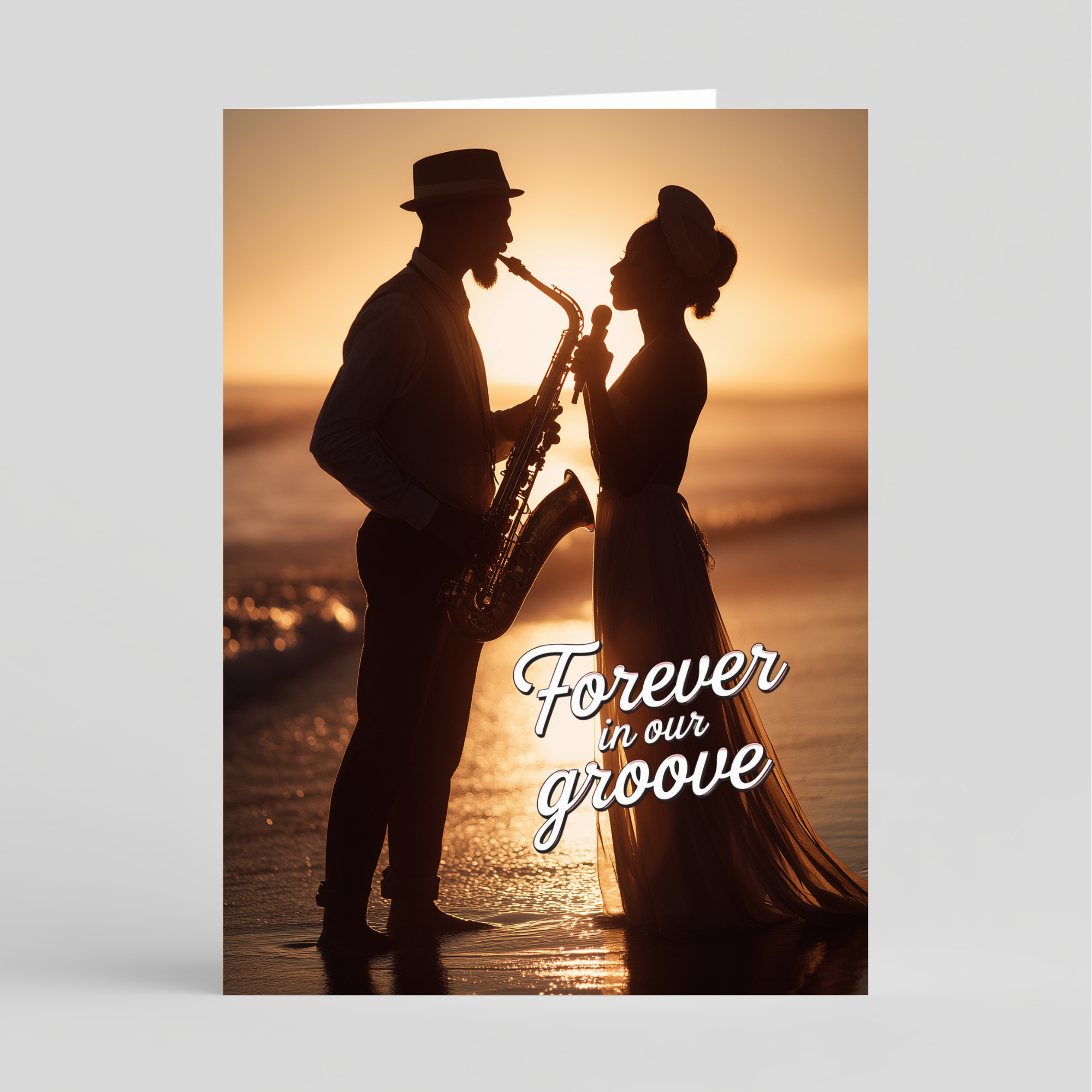 Card with silhouette of a couple on a beach with 'Forever in our groove' text at sunset.