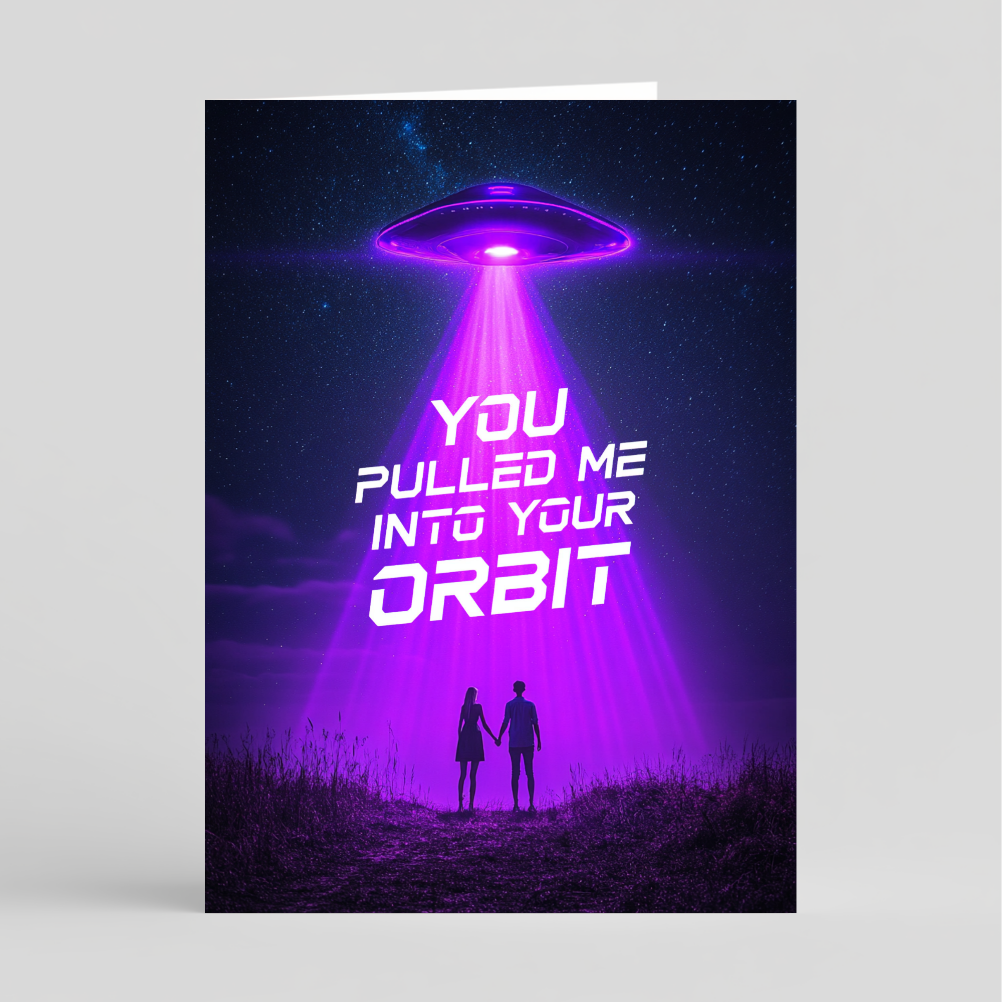 Card with a UFO and two people holding hands under a purple beam of light, with text 'You pulled me into your orbit'.