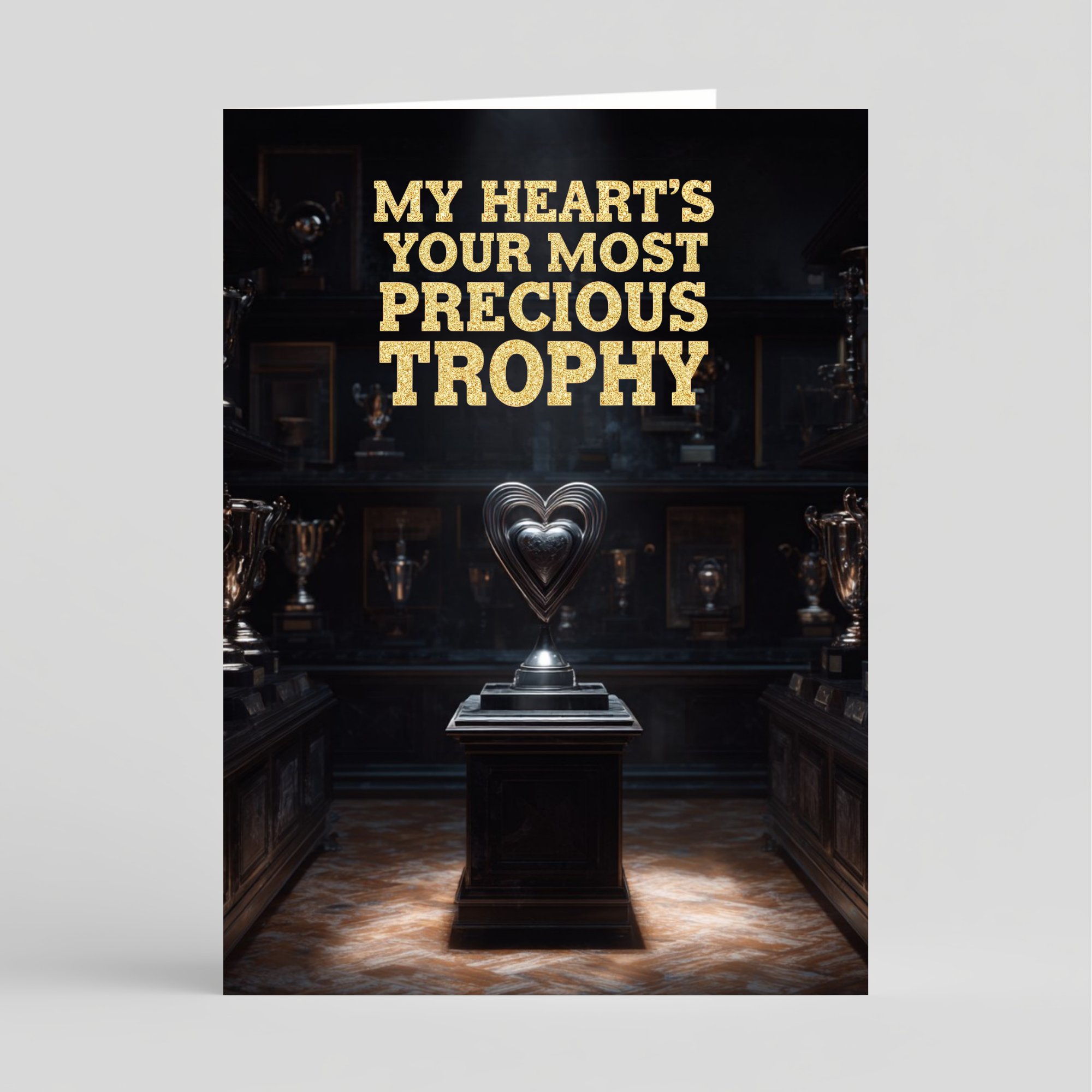 Card with trophies and a heart-shaped sculpture, featuring gold text.
